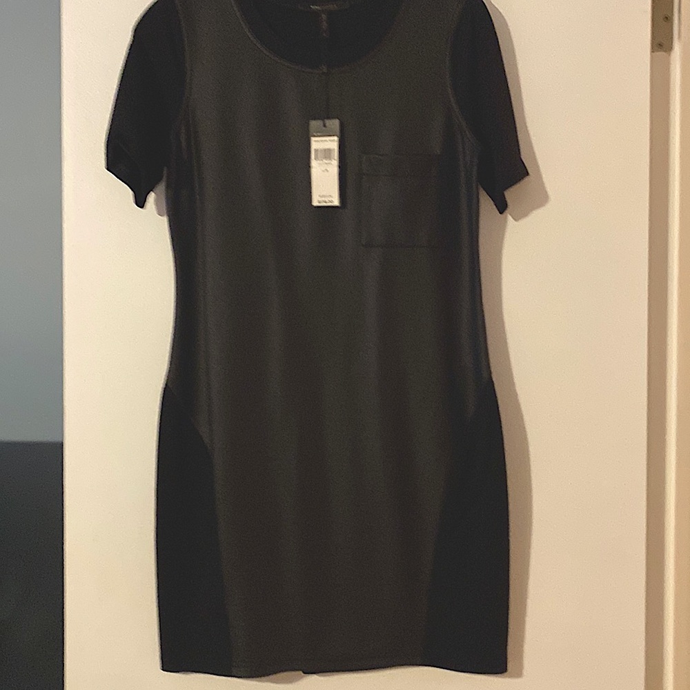 Never worn, with tags, size medium. Black midi dress
